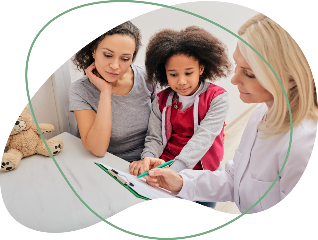 Tedoo practitioner explaining to a mom and her daughter